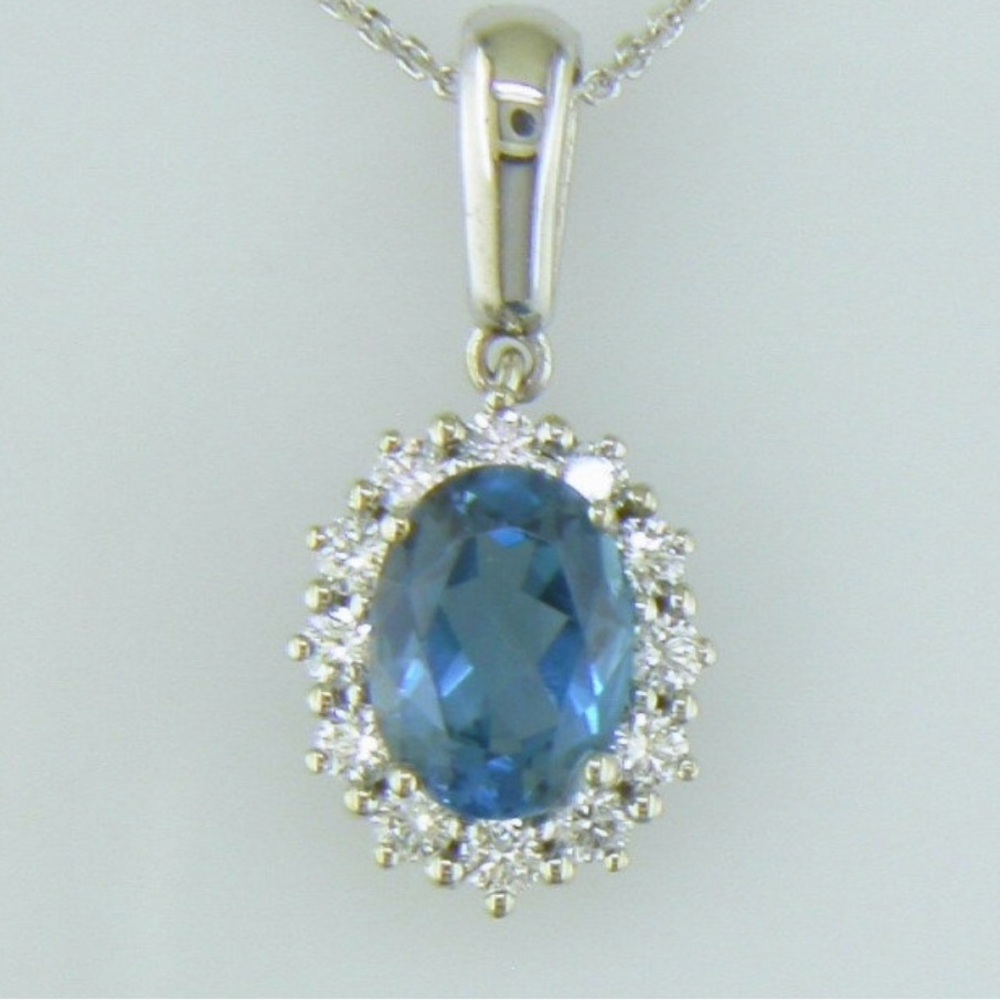 Solid 14k white gold blue topaz and natural diamond pendant